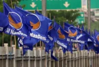 Berkibar Bendera Partai NasDem (foto:istimewa)