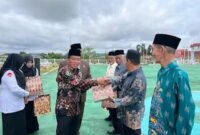 Ketua DPRD Murung Raya Rumiadi saat menghadiri upacara peringatan Hari Amal Bakti ke-80 di halaman Kantor Bupati (foto: istimewa)